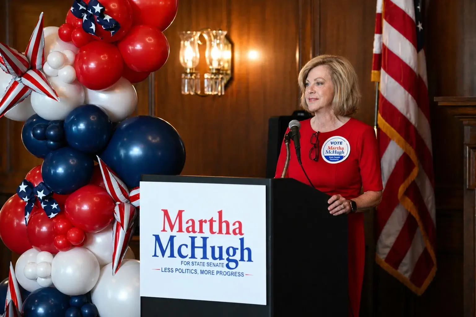 Martha McHugh speaking on stage